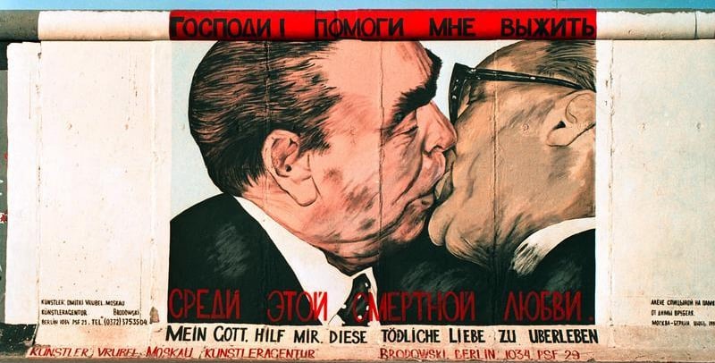 My God, Help Me to Survive This Deadly Love, by Dmitri Vrubel, Berlin, Germany
After the fall of the Berlin Wall in 1989, Russian artist Dmitri Vrubel painted this image of Leonid Brezhnev and Erich Honecker – ex-leaders of the Soviet Union and East Germany – embracing in a fraternal kiss on the wall’s eastern side.
