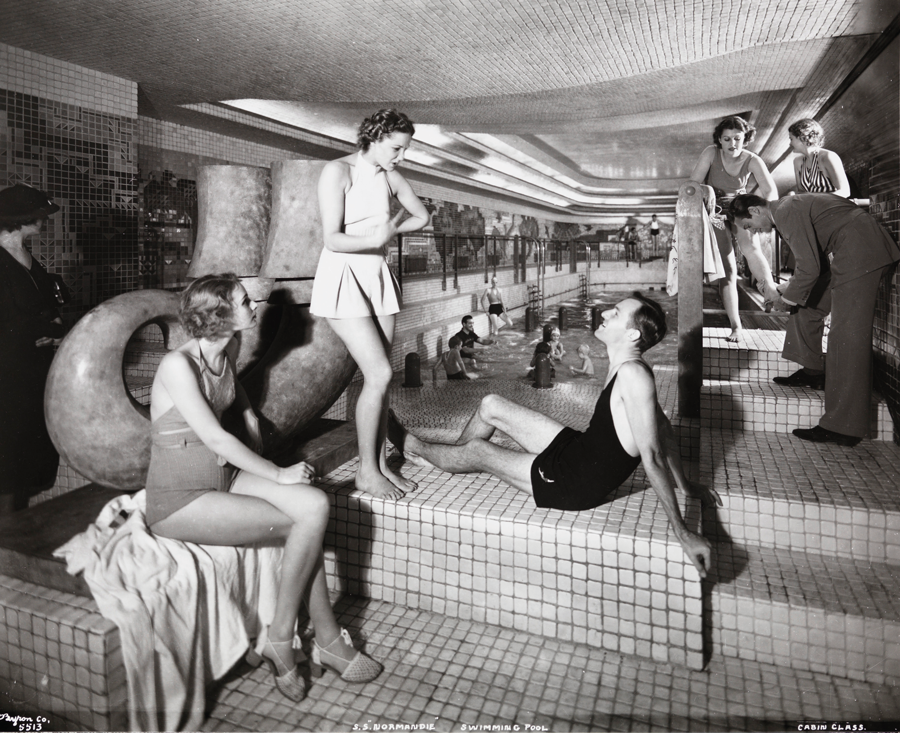 First-class passengers enjoy the swimming pool on board the Normandie, in the 1930s. 