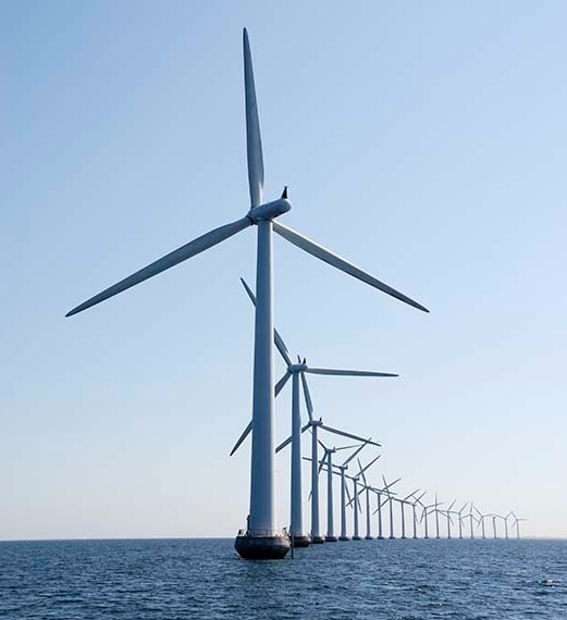 Curve of wind turbines at the ocean, vertical